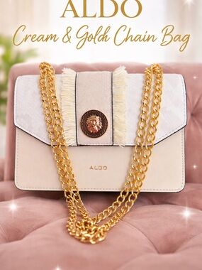 ALDO Cream Crossbody Bag with Gold Chain and Lion Medallion